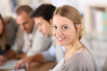 Portrait of beautiful blond girl in class