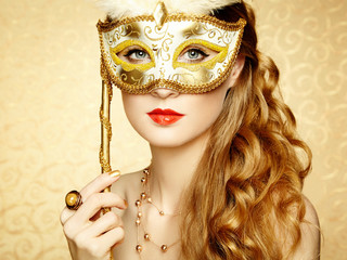 Canvas Print - Beautiful young woman in mysterious golden Venetian mask