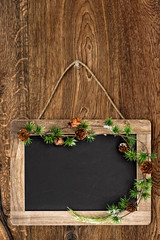 Wall Mural - chalkboard on wooden wall with christmas tree bruch