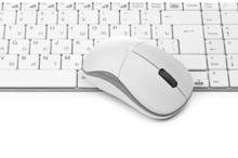 White Computer Mouse On The Keyboard