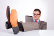© Viorel Sima - young business man smiles at tablet, with feet on desk