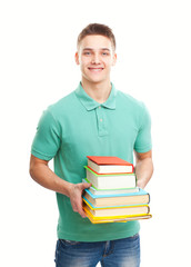 Wall Mural - happy smiling student holding stack of books isolated on white