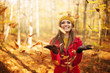 © gpointstudio - Happy woman throwing leaves
