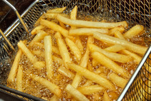 French Fries In A Deep Fryer Closeup
