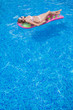 © popovich22 - beautiful girl floating on a mattress in the sea or swimming poo