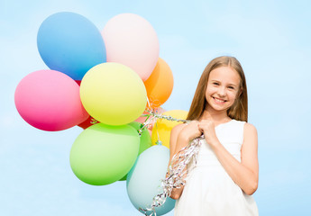 happy girl with colorful balloons