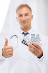 Sticker - male doctor with packs of pills