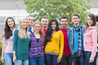 © WavebreakMediaMicro - Young college students standing in park