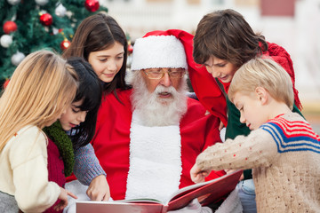 Children And Santa Claus Reading Book