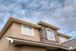 © ronniechua - Roofline showing gutter, soffit, windows, roof and stones