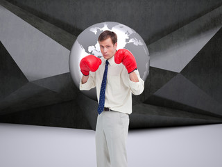 Composite image of businessman with his boxing gloves ready to f