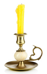 Old candleholder with candle isolated on white