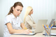 © Africa Studio - Woman in office at workplace