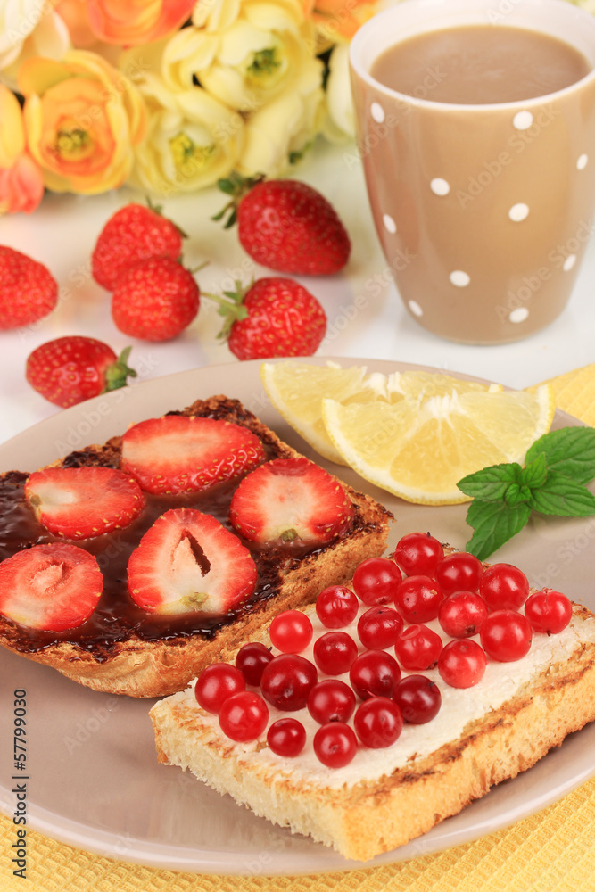 Delicious toast with berries on table close-up