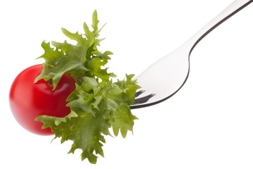 Fresh salad and cherry tomato on fork isolated on white backgrou