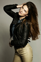 Glamorous young woman in black leather jacket