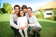 © goodluz - Cute family portrait of 4 people