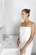 © Studio-FI - Woman getting ready in bathroom