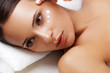 © puhhha - Close-up of a Young Woman Getting Spa Treatment. Cosmetic Cream