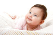 © Khorzhevska - cute funny infant baby looking up in left corner smiling and sho