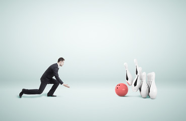 businessman playing bowling