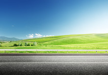 Asphalt Road And Perfect Green Field