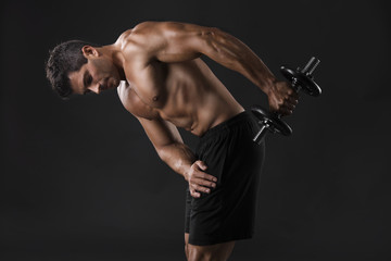 Wall Mural - Muscular man lifting weights