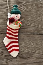 Christmas Stocking Against A Wooden Background