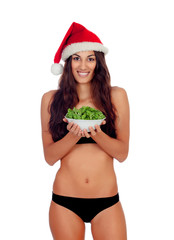 Wall Mural - Girl in black underwear and a Santa hat and a salad