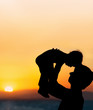 © natalinka29 - Father and little son - silhouettes on beach at sunset
