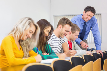 Canvas Print - Teacher with college students at the classroom