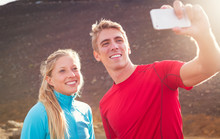 Young Attractive Athletic Couple Taking Photo Of Themselves With