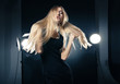 © julenochek - Beautiful woman posing at studio in light flashes