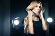 © julenochek - Beautiful woman posing at studio in light flashes