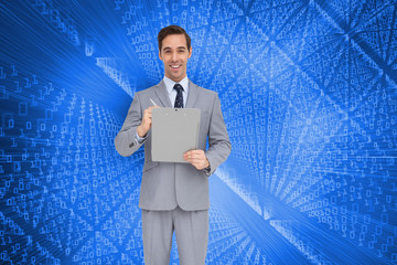 Wall Mural - Composite image of happy businessman holding a clipboard