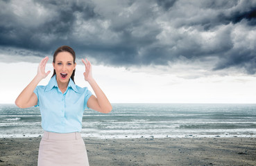 Wall Mural - Composite image of surprised stylish businesswoman posing