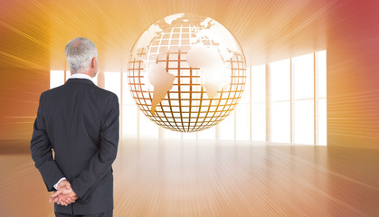 Poster - Composite image of rear view of mature businessman posing