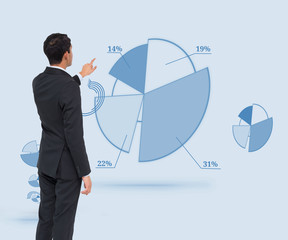 Poster - Composite image of asian businessman pointing