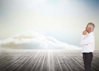 Poster - Composite image of thoughtful businessman posing