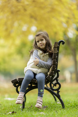 Wall Mural - Little girl at the bench