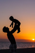 © natalinka29 - Father and little son - silhouettes on beach at sunset