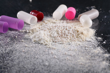 Macro shot of powder by open pills