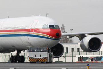 Wall Mural - Plane with tug truck