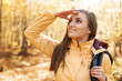 © gpointstudio - Young smiling female hiker looking far away