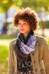 Autumn outdoor portrait of beautiful African American young woma