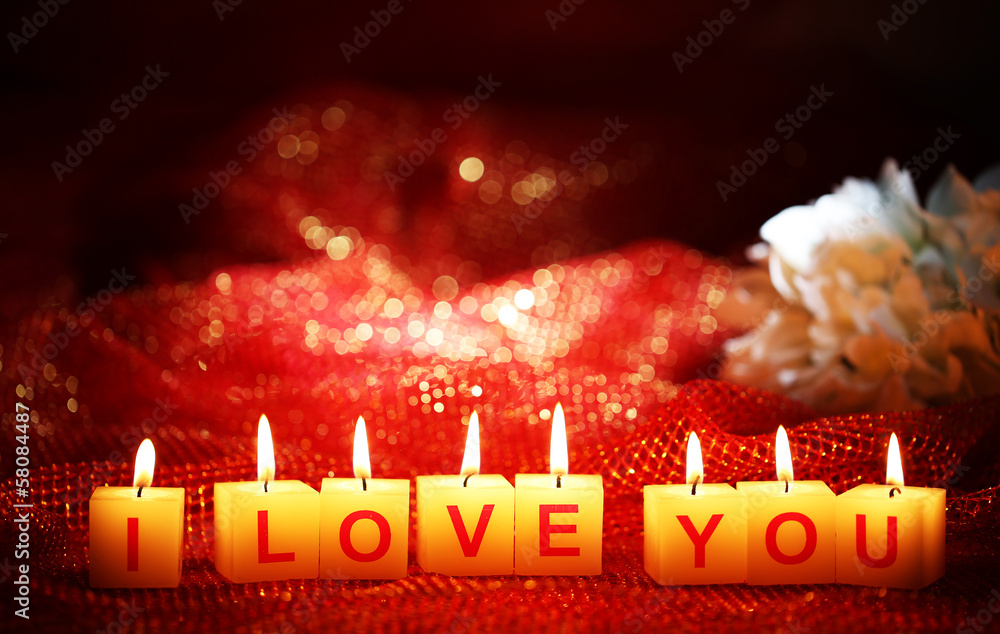 Candles with printed sign I LOVE YOU,on  bright background