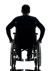 Wall Mural - rear view handicapped man in wheelchair silhouette