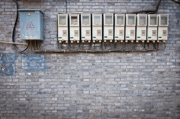 Poster - row of electricity meters and fuse boxes in hutong area, Beijing