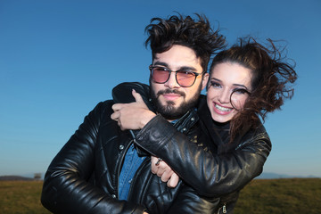 Canvas Print - woman with hands wrapped around her boyfriend smiling