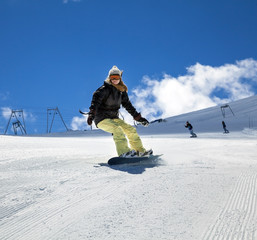 Snowboarder moving down